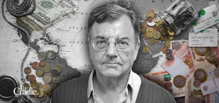 Photo Composition with Professor Michael Hudson (center), in the background, US dollars bills and coins over a map of America on the left and Russian Ruble bills and coins on the right. Photo: The Cradle.