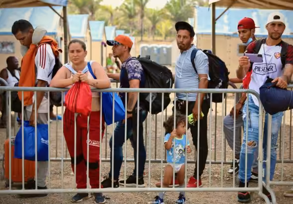 Migrants wait to be registered at San Vicente reception center after crossing the Darién Gap. Photo: IOM /Gema Cortés.