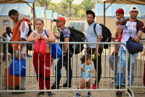 Migrants wait to be registered at San Vicente reception center after crossing the Darién Gap. Photo: IOM /Gema Cortés.
