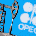 A 3D printed oil pump jack is seen in front of displayed OPEC logo in this illustration picture. File Photo