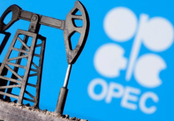A 3D printed oil pump jack is seen in front of displayed OPEC logo in this illustration picture. File Photo