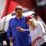 Venezuelan President Nicolás Maduro and his wife Cilia Flores dancing during the May Day celebrations in Caracas, Venezuela, on May 1, 2022. Photo: Reuters/Leonardo Fernández Viloria.