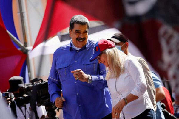 Venezuelan President Nicolás Maduro and his wife Cilia Flores dancing during the May Day celebrations in Caracas, Venezuela, on May 1, 2022. Photo: Reuters/Leonardo Fernández Viloria.