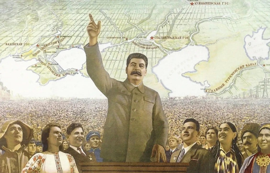Poster titled "Forward to Communism" showing Stalin leading thousands of people. Photo: Russian State Library.