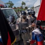 Demonstrators argue with police during a protest in Port-au-Prince. File Photo. 