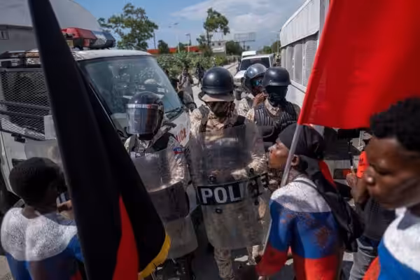 Demonstrators argue with police during a protest in Port-au-Prince. File Photo. 