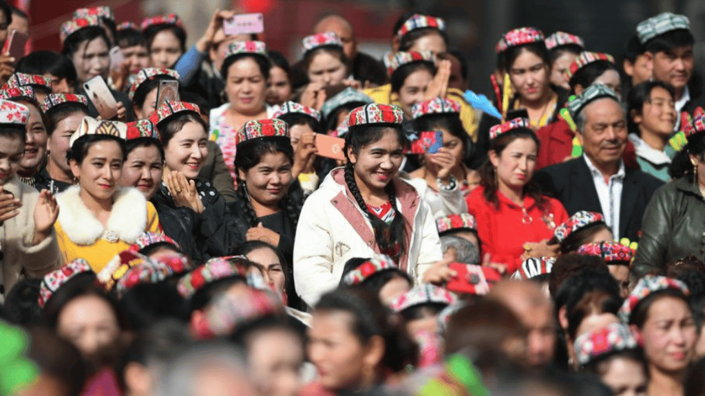 People attend a culture and tourism festival themed on Dolan and Qiuci culture in Awat County of Aksu Prefecture, northwest China's Xinjiang Uyghur Autonomous region, October 2019. Photo:Xinhua/Sadat.