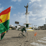 Man riding his bike near a rotonda at Puerto Quijaro, a municipality 569 kilometers from the capital of Santa Cruz, on the border between Bolivia and Brazil. Oct. 22, 2022. Photo: Twitter/@PaolaPteleSUR.