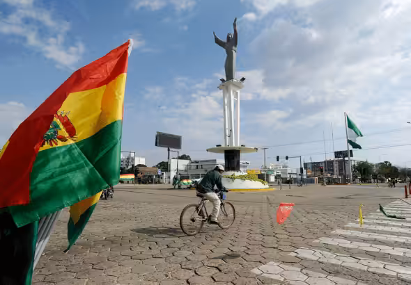 Man riding his bike near a rotonda at Puerto Quijaro, a municipality 569 kilometers from the capital of Santa Cruz, on the border between Bolivia and Brazil. Oct. 22, 2022. Photo: Twitter/@PaolaPteleSUR.