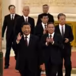 New members of the Communist Party of China's Politburo Standing Committee arrive at the Great Hall of the People in Beijing on Sunday. Photo: Ng Han Guan/AP.