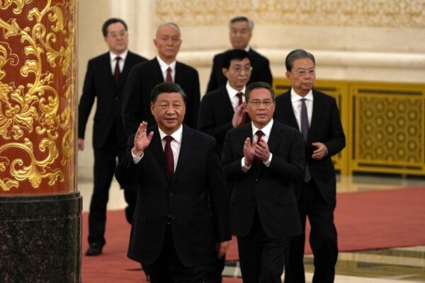 New members of the Communist Party of China's Politburo Standing Committee arrive at the Great Hall of the People in Beijing on Sunday. Photo: Ng Han Guan/AP.