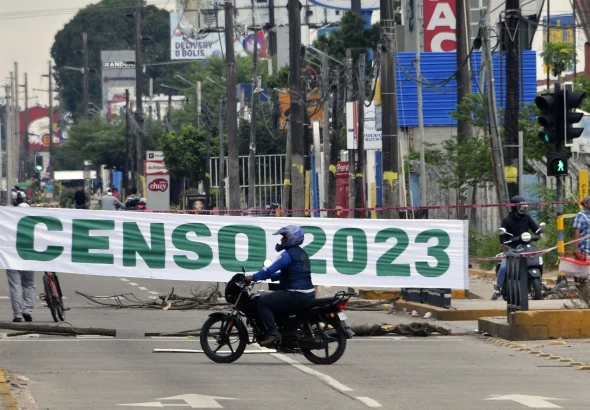 A motorcyclist rides through a blocked street during an indefinite strike in Santa Cruz de la Sierra, Bolivia. Photo: Aizar Raldes AFP.