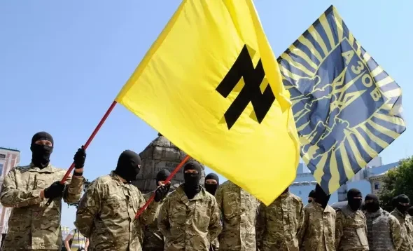 Azov battalion militants wearing military uniforms and balaclavas and holding Azov battalion flags. Photo: Sputnik/Alexander Maksimenko.