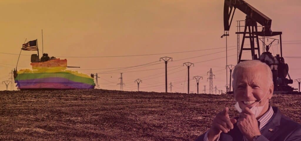 A tank carrying a US flag colored with the LGBTQ+ rainbow, patrolying near an oil rig in a dessert area. Photo: Rainer Shea.