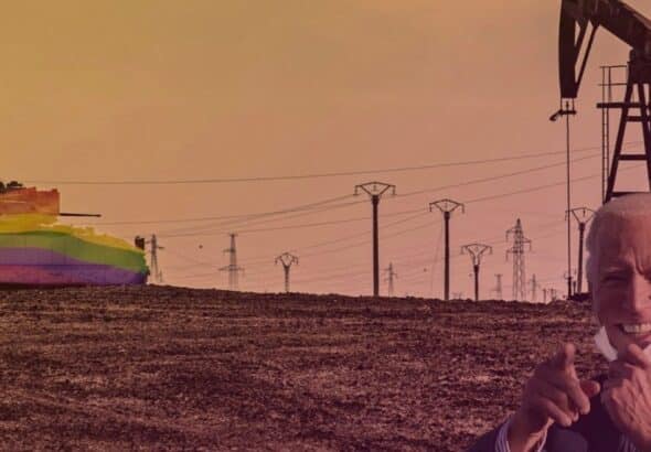 A tank carrying a US flag colored with the LGBTQ+ rainbow, patrolying near an oil rig in a dessert area. Photo: Rainer Shea.