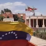 The flags of Iran and Venezuela are seen when Venezuelan President Nicolas Maduro arrives at Mehrabad Airport in Tehran, June 10, 2022. Photo by Reuters.