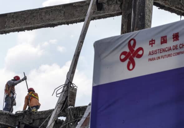 Workers carry out construction work during the demolition of the Salvadoran National Library to build a new one in San Salvador, El Salvador. Photo: Camilo Freedman/Photographer/Getty Images.