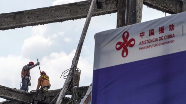 Workers carry out construction work during the demolition of the Salvadoran National Library to build a new one in San Salvador, El Salvador. Photo: Camilo Freedman/Photographer/Getty Images.