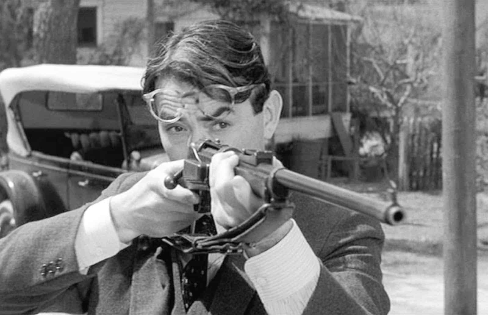 Atticus Finch from To Kill a Mockingbird holding a rifle. Photo: Scott Ritter Extra. 