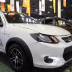 File photo shows a Saina car model manufactured by Iranian automotive company Saipa during a car show in the capital Tehran. Photo by IRNA.