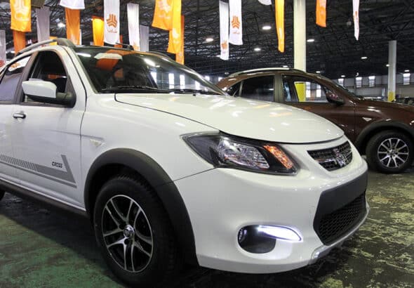 File photo shows a Saina car model manufactured by Iranian automotive company Saipa during a car show in the capital Tehran. Photo by IRNA.