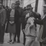 A woman is attacked during 1941 pogrom in Ukraine. File photo.