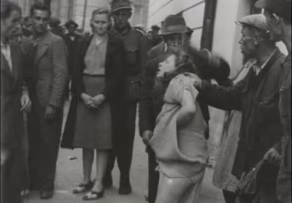 A woman is attacked during 1941 pogrom in Ukraine. File photo.