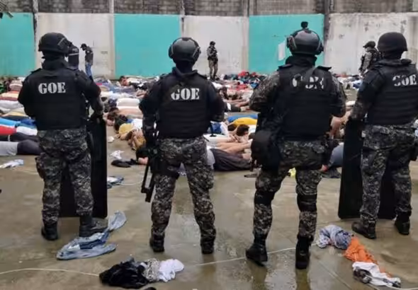 Security forces try to subdue a prison riot in Ecuador. File photo.