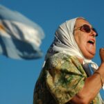 Argentinian revolutionary leader and human rights activist Hebe de Bonafini giving a speech as the flag of Argentina waves in the background. Photo: Twitter/@NicolasMaduro.