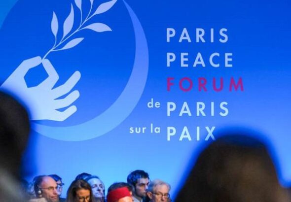 A banner reading "Paris Peace Forum, de Paris sur la paix," displayed at the forum. File photo.