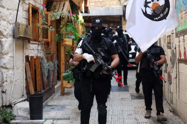 Members of the Lions' Den during a memorial service for Mahmoud al-Azizi and Aboud Suboh who were killed by Israeli forces in the Palestinian city of Nablus. Photo: Shadi Jararah/APA Images.