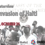 Poster with details of the interview and a photo of some people gathering in front of the US embassy in Port-au-Prince, Haiti. Photo: Orinoco Tribune.