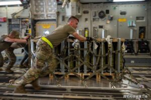 US soldiers pushing a trolley filled with missiles. Photo: US Air Force/Airman 1st Class Cydney Lee.