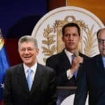 Photo composition with Henry Ramos Allup (left), Juan Guaido (center) and Julio Borges (right), also, the coat of arms and the flags of Venezuela in the background. Photo composition: Orinoco Tribune.