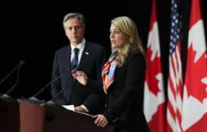 US Secretary of State Antony Blinken listens as Canadian Foreign Minister Melanie Joly speaks during a joint press conference following bilateral talks in Ottawa on Oct 27. Photo: The Canadian Press via AP.