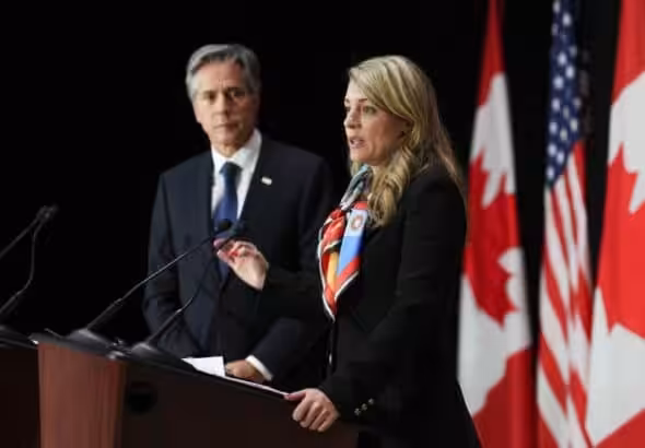 US Secretary of State Antony Blinken listens as Canadian Foreign Minister Melanie Joly speaks during a joint press conference following bilateral talks in Ottawa on Oct 27. Photo: The Canadian Press via AP.