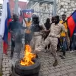 Haitian police, attached to the de facto, neocolonial government of Prime Minister Ariel Henry, attempt to break up a protest where Haitians are in opposition to an international military force, Port-au-Prince, Oct. 24. Photo: Odelyn Joseph/Popular Resistance.