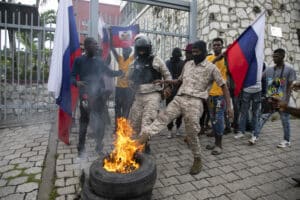 Haitian police, attached to the de facto, neocolonial government of Prime Minister Ariel Henry, attempt to break up a protest where Haitians are in opposition to an international military force, Port-au-Prince, Oct. 24. Photo: Odelyn Joseph/Popular Resistance.