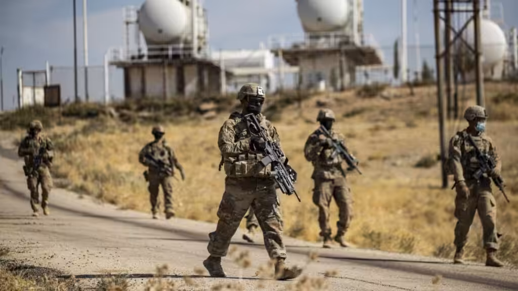 American soldiers patrolling near an oil production. Photo: AFP.