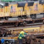 A rail employee works a Union Pacific Intermodal Terminal rail yard on November 21, 2022 in Los Angeles, California. Photo: Mario Tama/Getty Images.