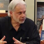 Arnold August speaks at an event for his book Cuba-US Relations: Obama and Beyond. Photo:Jon Flanders.