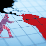 Map of the Western Hemisphere with South America colored in red, an “Uncle Sam” can be seen in a corner pointing at it. Photo: Prensa Latina.