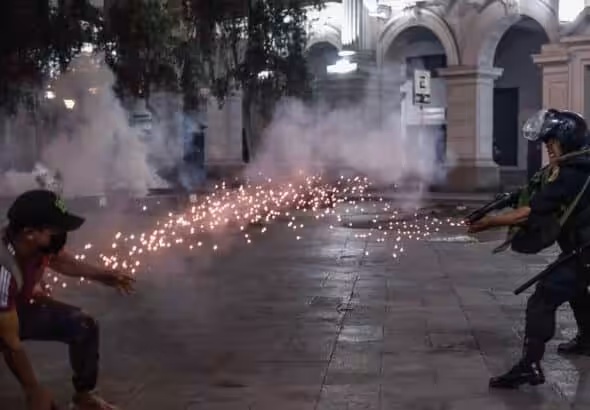 Unarmed Peruvian protester demanding the release of President Castillo and the dissolution of Congress being shot at point blank by the police. Photo: EPA.