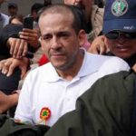 The governor of Santa Cruz, Luis Fernando Camacho, being escorted by the Bolivian police after his arrest in the Coup d'État I case. Photo: Javier Mamani/Getty Images.
