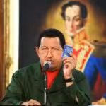 The late president of Venezuela and leader of the Bolivarian Revolution, Hugo Chávez, holds in his hand the Constitution of the Bolivarian Republic of Venezuela. File photo.