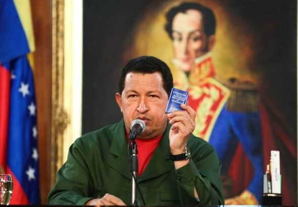The late president of Venezuela and leader of the Bolivarian Revolution, Hugo Chávez, holds in his hand the Constitution of the Bolivarian Republic of Venezuela. File photo.