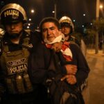 Police detain an activist calling for the return of deposed president Pedro Castillo. Photo: Juan Zapata.