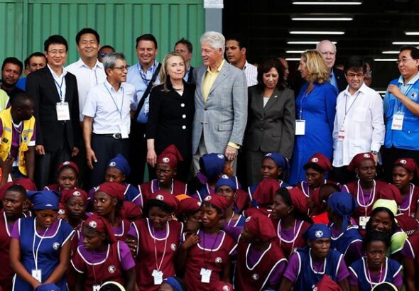 Hillary Clinton, Secretary of State, and former president Bill Clinton at opening of garment factory in Haiti on October 22, 2012. Photo: Getty Pool/Black Agenda Report.
