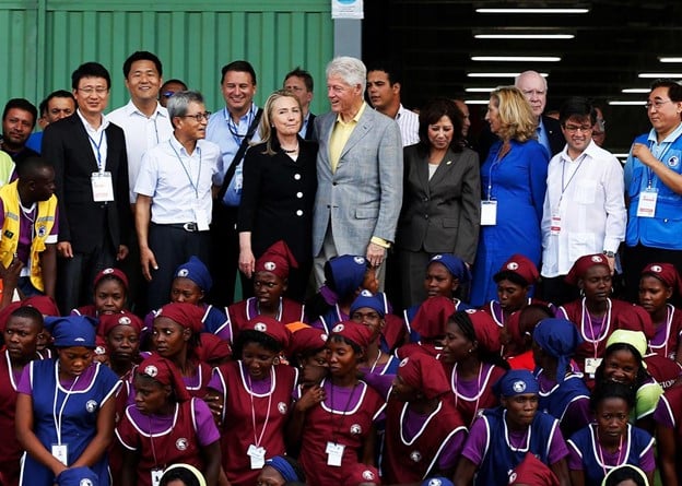 Hillary Clinton, Secretary of State, and former president Bill Clinton at opening of garment factory in Haiti on October 22, 2012. Photo: Getty Pool/Black Agenda Report.
