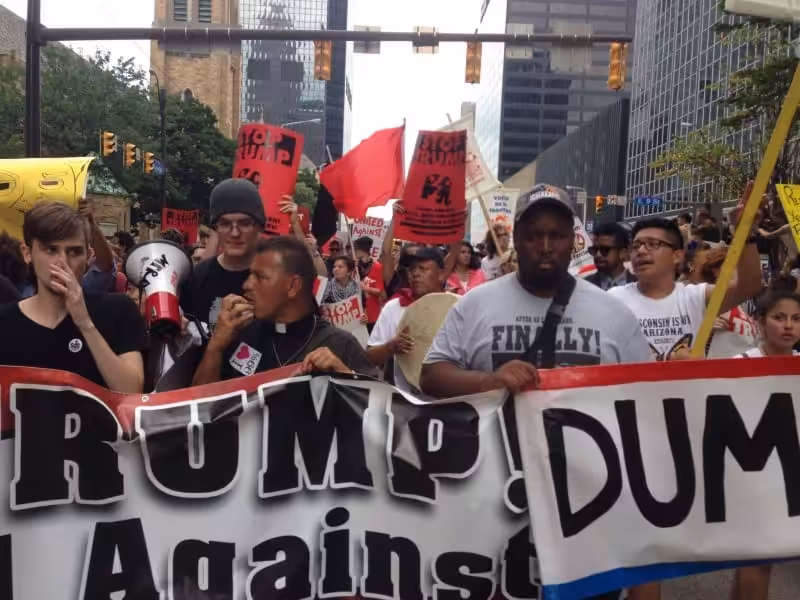 Father José Landaverde leading chants on the march on the Republican National Convention in Cleveland, Ohio. Photo: FightBack News